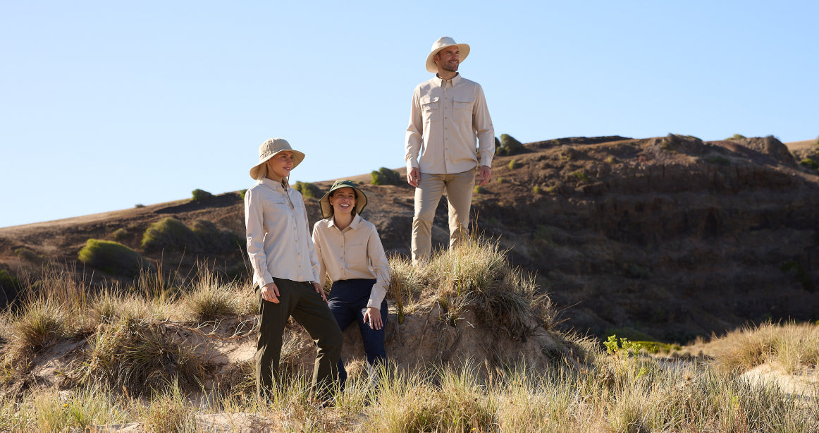 People standing on a hill wearing Solbari sun hats and clothing.