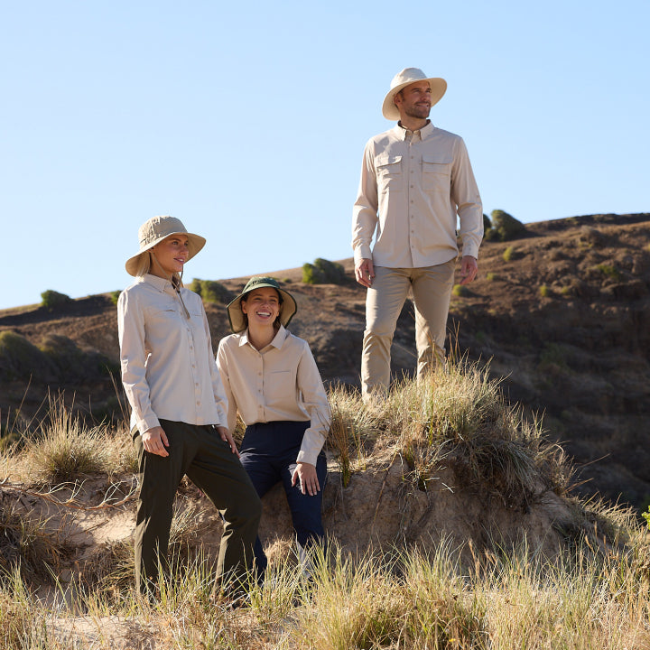 People standing on a hill wearing Solbari sun hats and clothing.